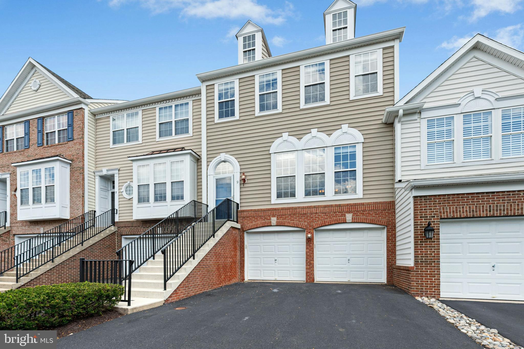 Welcome to this expanded townhome—the largest interior model in the highly desirable community of Doylestown Station. Featuring 4 bedrooms, 3.5 baths, and thoughtful upgrades, this home offers generous living spaces with modern design and elegant detail. Hardwood floors, coffered ceilings, crown moldings, and luxurious finishes enhance the open floor plan and seamlessly blends indoor and outdoor living. The expansive kitchen boasts abundant cabinetry, granite countertops, upgraded stainless appliances, gas cooking, and a pantry—an entertainer’s dream. A sunroom with double-sided fireplace opens to a large deck overlooking peaceful greenery. Upstairs, the Primary Suite impresses with tray ceiling, an expansive walk-in closet, and a spa-like bath with a stunning walk-in shower. Two additional bedrooms, a tiled hall bath, and a convenient upstairs laundry with cabinetry complete this level. The fully finished walk-out ground-level living space adds a versatile recreation room, additional bedroom or home office, and a full bath. Ideal for generational living. Plus a newer roof, refrigerator, carpeting, the list goes on and on. All within the award-winning Central Bucks School District, just a short walk to Central Park, Kids Castle, and community trails, with concerts, green spaces, and outdoor recreation at your doorstep. Minutes from the shops, dining, and cultural attractions of historic Doylestown Borough. This rare offering blends space, style, and convenience—turnkey living awaits.