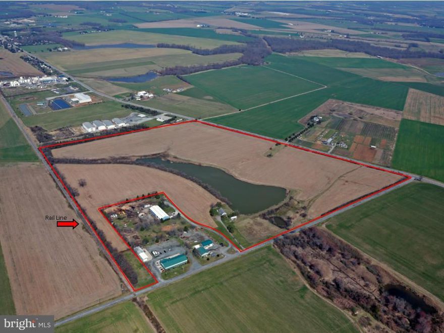 Industrial Zoning adjacent to Rail line. 62 tillable acres, leased for CY2016. 8 AC Pond.
