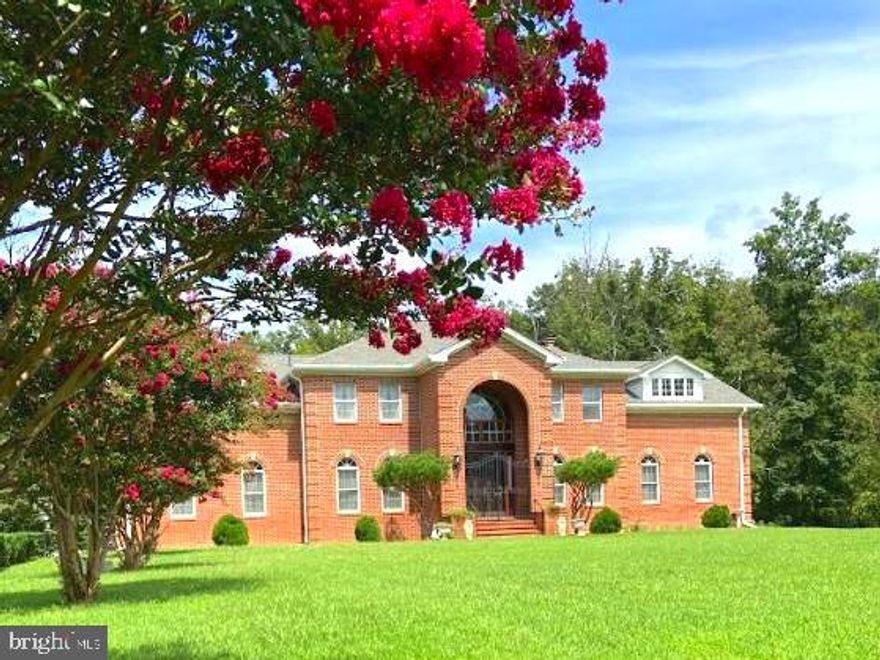Welcome home to 11816 Washington St. — a stunning, all-brick estate privately situated on approximately 2.82 acres in Fairfax. Built in 1995, this expansive residence offers timeless craftsmanship, incredible space, and an exceptional opportunity to customize a truly special home.


Featuring 5 bedrooms and 5.5 bathrooms, this home is designed for both everyday living and grand entertaining. From the moment you enter, you’ll notice the elegant curved open staircase, soaring vaulted ceilings (9+ and 15+), crown molding, skylight, and an abundance of windows that fill the home with natural light. Marble imported from Brazil and hardwood flooring add to the home’s classic appeal.


The main level offers formal living and dining rooms, along with a spacious entertainment area equipped with a built-in surround sound audio system. Three fireplaces—one on each level—create a warm and inviting atmosphere throughout.

This home features two primary suites, including one with its own fireplace, offering flexible living arrangements. Additional highlights include multiple attic access points for ease of maintenance.


The walkout basement is ideal for entertaining complete with built-ins, coffered ceilings, recessed lighting, and large windows providing excellent natural light.

Major system updates provide peace of mind, including a newer roof and gutters (approx. 4 years), dual-zone HVAC with updated systems (main level approx. 3 years, upper level approx. 4 years), two hot water heaters (approx. 6 years), a new well tank (1 year), whole-house air filtration system, and a new sump pump.



Outdoor features are equally impressive, with a newer deck (approx. 2 years), a recently paved driveway (18 months), and beautifully landscaped grounds. The property is secured with iron and brick fencing along the front and side, along with a private iron gate and a long driveway lined with lighting for a grand entrance.


Additional features include a water softener and plenty of parking for family and guests! For the busy commuter, this home is perfectly situated just minutes to the Fairfax County Parkway, route 29 and route 66. 


This is a rare opportunity to own a beautifully built estate with incredible bones, modern system updates, and endless potential to make it your own. Schedule your showing today!