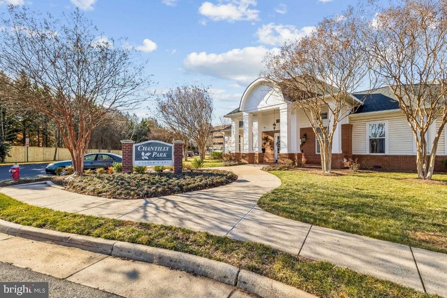 Stunning top-level condominium in Chantilly Park Condos featuring bright, open interiors, 2-deeded garage spaces, and same level storage unit. This inviting home offers vaulted ceilings and a gas fireplace that anchor the spacious living area, complemented by gas cooking, a well-appointed kitchen with pantry, and a full-sized washer/dryer conveniently located on the main level of the unit. The private primary bedroom includes a walk-in closet. The full bathroom features a generous soaking tub/shower combination. A versatile loft area with built-in desk workspace is perfect for an office, guest area, or playroom. You'll appreciate the natural light and elevated courtyard views from this upper unit. The water heater was replaced in 2025. Two deeded parking spaces (D31 & D33) and a deeded storage unit (85) with shelving and lock are included. One parking space is currently leased at $650 for six months and may convey to the new owner if desired; otherwise the lease will terminate and both spaces will be available at settlement. There is elevator service from the 1st level mailbox bank to the 4th level unit; direct access to the fourth level from your parking spaces. This is an ideal location with easy access to shopping, commuter routes, and neighborhood amenities. Condo fee is $557.22/mo plus a $33.20 parking fee.