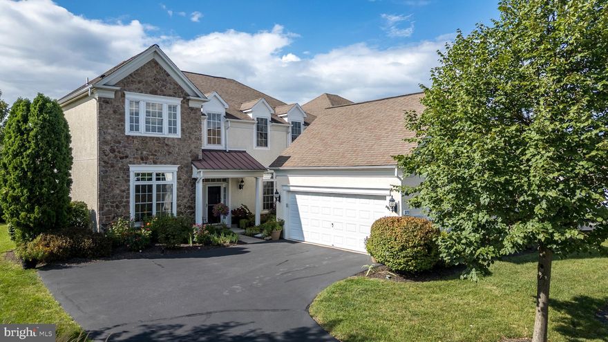 Rare opportunity in the sought-after, gated, 55+ community, Reserve at Gwynedd, to purchase this extra-spacious and beautifully designed Wharton Manor Home offering the comfort of a main bedroom on the 2nd floor while also providing the potential for a first-floor primary suite. This lovely home offers a bright, open floor plan filled with natural light and soaring ceilings. The 2-story Entrance Foyer features new custom satin-finished hardwood flooring and wainscoting and opens to a cozy Den with French Doors and included shelving. The dramatic 2-story Family Room with a wall of windows, gas fireplace and a Dry Bar with granite counter, under-cabinet lighting and custom cabinets, providing a perfect gathering place for relaxing or entertaining. The Family Room is open to the spacious Kitchen with new custom, satin-finished hardwood flooring, granite counters, 42” cabinets, GE Profile double wall ovens, 5-burner gas stove with tiled backsplash, new Bosch dishwasher, double sink with new garbage disposal and a granite breakfast bar with 3 included bar stools. The Breakfast Area provides a sliding glass door to the rear Deck. The formal Dining Room features a tray ceiling, chandelier and wainscoting and connects to the Butler’s Pantry with granite serving counter, pantry closet and 42” cabinets. Unique to this model is the very spacious Office with wainscoting and crown molding. This room is located adjacent to the Powder Room, which would make it possible to convert the Office to a Primary Bedroom and convert the Powder Room to a Full Bath. Completing the 1st Floor are the Laundry Room with included washer and dryer and the Mud Room, both with tiled floors. Stairs with hardwood treads lead to the 2nd Floor with a hallway overlooking the Family Room. The luxurious Primary Bedroom Suite includes a Bedroom with tray ceiling, 2 walk-in closets, and a Full Bath with tiled floor, whirlpool tub, 2 separate vanities with corian counters and a stall shower with tiled surround, 2 shower-heads and a bench seat.  2 additional bedrooms share a Jack and Jill Full Bath with soaking tub and shower and double sinks with Corian counter. The utility closet on this floor houses the Lenox gas furnace with new whole house humidifier and new Navien tankless hot water heater. The 2-Car Garage includes built-in storage shelving, an included bike rack and included shelving. Outdoor living is just as inviting. Step out onto the beautiful maintenance-free Trex rear deck spanning the entire width of the house,  providing an ideal setting for morning coffee, outdoor dining, or to simply enjoying peaceful moments overlooking the rear grounds. Life here is about more than just the home—it’s about the lifestyle. This vibrant 55+ community offers exceptional amenities, including a clubhouse, gym, indoor and outdoor pools, and a wide variety of continuous social activities and clubs designed to help neighbors connect and stay active. The professionally maintained grounds add to the welcoming and resort-like atmosphere. This community provides easy access to excellent shopping in the nearby Blue Bell shopping centers. It is also convenient to Wegmans, Costco, Trader Joe’s and Whole Foods. There is easy access to main routes including 202 and the PA turnpike. With its generous size, flexible floor plan, and resort-style community amenities, this home offers the perfect blend of comfort, convenience, and active adult living.