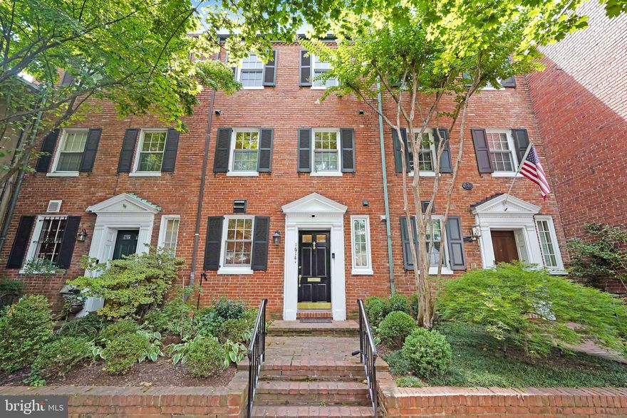 Welcome to a charming and elegant townhouse nestled in the prestigious neighborhood of Georgetown. This immaculate property offers a perfect blend of historical charm and modern amenities, providing an exceptional living experience in one of the capital's most sought-after locations. The classic red-brick showcases the timeless architecture that Georgetown is renowned for, and the inviting façade is complemented by well-maintained landscaping, adding to the property's curb appeal. The mature trees lining the street and the beautiful ironwork details contribute to the character and charm of the neighborhood.

Stepping inside, you'll be greeted by an inviting foyer that leads to the main living areas. The interior boasts a seamless combination of traditional elements and contemporary finishes creating a warm and welcoming atmosphere. The spacious living room is bathed in natural light, thanks to large windows that overlook the tree-lined street. An elegant fireplace adds a touch of coziness and serves as a focal point for the room where high ceilings, and pristine hardwood floors enhance the overall sense of openness and sophistication.

The gourmet kitchen is a chef's delight, featuring stainless steel appliances, ample storage, and granite countertops. The kitchen's design strikes a perfect balance between functionality and style, making it a perfect space for culinary adventures and entertaining guests. Adjacent to the kitchen there is a gracious dining area perfect for hosting intimate dinners or larger gatherings. The space is well-appointed with tasteful lighting fixtures and offers a seamless flow from the kitchen. 

Ascending the staircase, you'll find the luxurious bedrooms on the upper floors. The master suite is a tranquil retreat with an en-suite bathroom that exudes relaxation and elegance. Other bedrooms are generously sized, each offering its own unique charm and comfort. The bathrooms are beautifully designed with modern fixtures and finishes. Marble accents, stylish vanities, and contemporary fittings create a spa-like ambiance, providing a soothing escape from the bustling city life. The property boasts a private and serene backyard oasis, perfect for outdoor entertaining or enjoying a peaceful moment surrounded by nature. The hardscaped patio provides a cozy space for al fresco dining or simply lounging in the fresh air. The full-size garage fits a Chevrolet Suburban or similar sized car ensuring easy parking no matter the time of day. This home offers an exceptional opportunity to own a piece of Georgetown's rich history while enjoying the modern comforts of an updated townhouse. This property is a rare gem that perfectly encapsulates the essence of Georgetown living. Don't miss your chance to call this exquisite address your home!