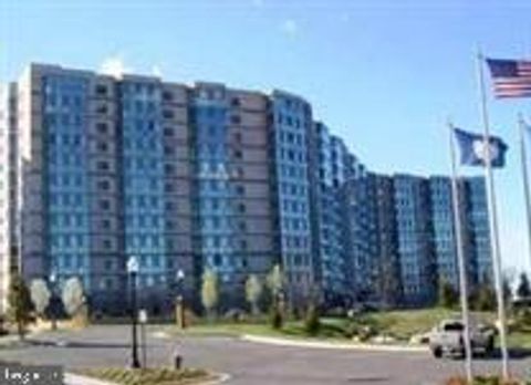 Photo of 19365 Cypress Ridge Terrace #306, LEESBURG, VA 20176 (MLS # VALO2120558)