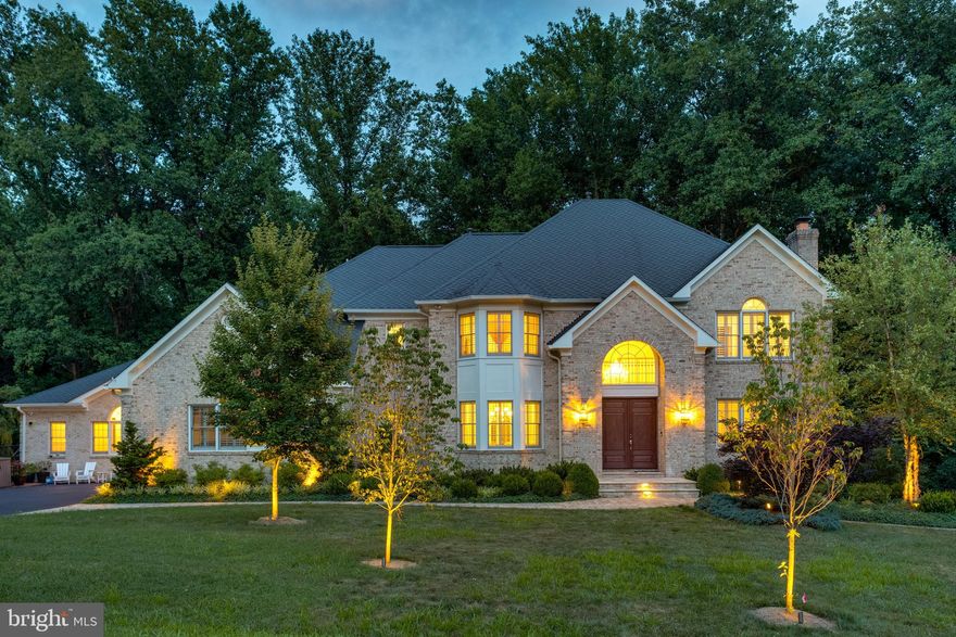 DON'T MISS THE WALK-THROUGH VIDEO** This spectacular custom all brick colonial includes an AMAZING CONNECTED BUT PRIVATE 2 LEVEL IN LAW SUITE WITH OVER 3000SQFT, FEATURING A PRIMARY BEDROOM, TWO AND A HALF BATHS, CATHEDRAL CEILINGED SECONDARY GREAT ROOM, LARGE PRIVATE KITCHEN, WORK-STATION HUB, PRIVATE ENTRY, PLUS ITS OWN LOWER LEVEL WITH A FINISHED REC ROOM, AND SECOND BEDROOM SO EVEN THE IN-LAWS CAN HAVE VISITING GUESTS AND FAMILY MEMBERS. ***Almost $1,200,000 IN UPGRADES throughout the last 10 years! Style, size, incomparable quality, glamour, spaciousness, and location are all a part of a features list that would fill a novel. INCLUDING, **Motorized shades, Timed LED recessing lights system, Sonos system with ceiling speakers, Plantation shutters, & MORE! There is a **2-STORY FOYER with curved staircase,  gorgeous **TOTALLY RENOVATED CHEFS CALIBER ISLAND KITCHEN with SS appliances, and dining area opening to a **LIGHT FILLED VISTA ROOM WITH GLASS WALLS AND FULL GLASS SOLARIUM CEILING. The **2-STORY GREAT ROOM is light filled with vista windows overlooking the decks and valley below. The **MULTI-PURPOSE SERVICE ROOM  with island is used as the FAMILY FOYER with individual cubbies, work stations, laundry & pet grooming! The upper level features **UPDATED BATHS, 3 LARGE BEDROOM plus PRIMARY SUITE with double sided fireplace. The **LOWER LEVEL  is complete with a rec room, EXTRA BEDROOM, exercise area, REFRESHMENT KITCHEN plus access to the WALK OUT PATIO!