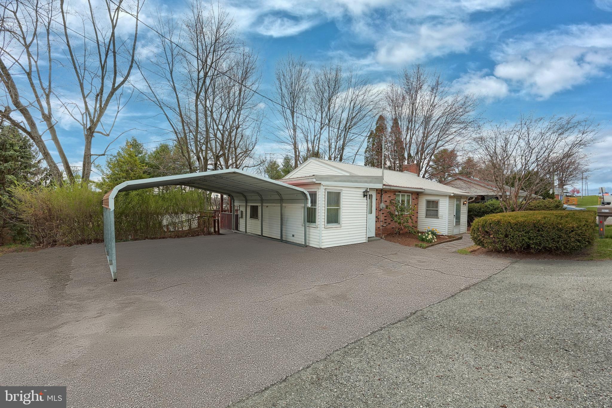 Beautifully remodeled ranch-style home in the highly regarded Dallastown School District. Home has metal roof. This thoughtfully updated residence features fresh paint throughout, new flooring, modern lighting, and stylish six-panel interior doors. The kitchen has been fully renovated with new cabinetry, counter-tops, brand-new stainless steel appliances, while the main-level bathroom has also been updated and is handicapped accessible. First floor finished family room that opens to partially covered deck overlooking rear yard. Modern HVAC systems. Lot is L-shaped with driveway to side road which also accesses Cape Horn Rd and makes it easier to use the outbuildings
The property includes a spacious attached two-car carport (10’x18’) and a private second entrance off Cape Horn Rd. leading to a 30’x14’ pole barn with an 11-foot overhead door and carport. Additional storage is available with two sheds (10’x18’ and 8’x10’).
The full basement offers a second full bathroom, a professionally installed waterproofing system with a sump pump, and a transferable full warranty. Outdoor living is enhanced by a large rear deck, a covered patio, and a handicap-accessible ramp.
For year-round comfort, the home is equipped with a modern, high-efficiency gas forced-air furnace and central air conditioning.