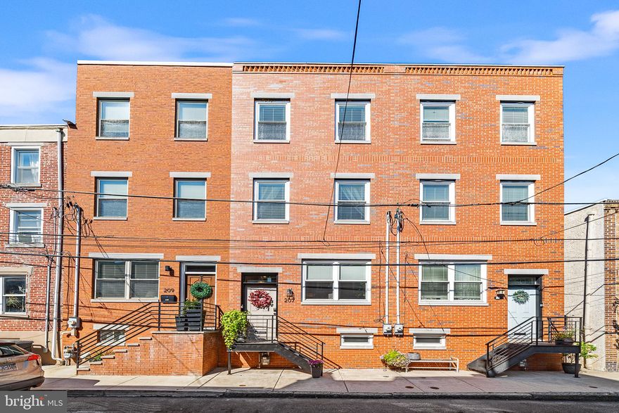 Welcome to this exquisite home in Philadelphia's quaint neighborhood of Pennsport, built in 2017. Nestled on a charming tree-lined block just off Dickinson Square, this residence offers a seamless blend of modern elegance and practical design. As you enter the first floor, you are greeted by a spacious & light-filled , open living and dining area, highlighted by soaring ceilings, intricate crown molding, and rich wood flooring. The kitchen is flooded with natural light, featuring sleek tile flooring, large peninsula for seating, quartz countertops, a subway tile backsplash, and stainless steel appliances. The large glass door completes the first level, leading you to a spacious outdoor patio area, complete with a show-stopping pergola adorned with vines and twinkle lights, creating privacy, shade, and ambiance. On the second floor, discover two well-appointed bedrooms, each featuring deep double closets, with custom organization systems and ample windows. The hallway bath on this level offers a serene retreat with a deep soaking tub, and double dual vanity. Ascending to the third floor, the primary suite awaits, boasting high ceilings, two double south-facing windows, and a walk-through, custom closet. The en-suite bath is a sanctuary with its oversized stall shower enclosed in glass and a dual vanity with quartz countertops. This floor also includes an open area with a wet bar and access to a private terrace. From here, spiral steps lead up to a rooftop deck that offers breathtaking 360-degree skyline views. The lower level is a versatile space, finished to include a laundry area, a half bath, and a storage/mechanical room. This flexible space can be used as a media room, home office, gym, or playroom—catering to your lifestyle needs. Conveniently located near parks, transportation, libraries, and the waterfront, this home also includes tax abatement with 4 years remaining. Welcome to 207 Mountain Street, where every detail has been thoughtfully designed for comfort and style.