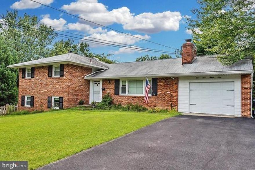 This spacious split-level home in Glen Forest offers a blend of comfort and style, featuring 5 bedrooms and 3 full bathrooms. The interior has a traditional floor plan with wood floors, a dining area, and a kitchen with ample table space. The home is equipped with a dishwasher, microwave, and washer/dryer for convenience. Large, secluded lot that backs to trees, providing a peaceful view of the creek and woods. The property features a deck and back patio for outdoor enjoyment. Parking is hassle-free with an attached garage and asphalt driveway. Available NOW with flexible terms from 12 to 24 months. This home is a perfect retreat, combining modern amenities with a tranquil setting. Don't miss the opportunity to make it yours! Pets OK, considered on a case-by-case basis. No smoking.