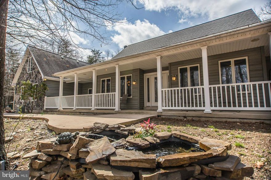 Completely custom contemporary ranch-plus w/views on 3-acre private wooded hilltop. Walls of windows thru-out. Chef's kitchen w/granite, SS & walk-in pantry. LR cherry floors, vaulted ceilings, gas log stone FP & hand-crafted media cabinetry. MBR w/spa bath+WIC. Multiple outdoor living areas. Bonus office/playroom over garage. Media room+workshop+family room+storage galore+zoned HVAC. Min.restrict