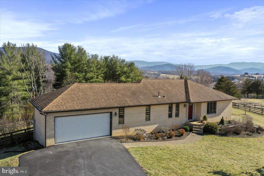 Welcome to 240 Cavalli Court, Front Royal, VA
Embrace the tranquility of countryside living in a stunning mountaintop home that offers the perfect blend of natural beauty and modern comfort. This property is a rare jewel. Gorgeous mountain views over 10 acres of rolling land surround this beautiful mountaintop home. The acreage is partially cleared for peaceful views overlooking Skyline Drive, the Blue Ridge Mountains, and the Shenandoah River. Choose your view from either of the two decks or the lower level patio to enjoy stunning sunsets or sunrises. Wildlife enthusiasts will appreciate sightings of wild turkeys, heron, eagles, and deer, while equestrians can watch their horses grazing in the fenced pastures. This property is over 10 acres in total with 6 board fenced pastures. The acreage is partially wooded on the mountainside with rolling pastures, and a 4 stall horse barn, run in shed and carriage house.
This home offers so much more than just breathtaking views. The spacious interiors are bathed in natural light and feature abundant storage and two finished levels with 3 bedrooms and 2 ½ baths. Hardwood and tile floors make maintenance a breeze. The open concept kitchen has granite countertops and cherry soft close cabinetry.  The owner's meticulous maintenance and remodeling efforts over the years are evident throughout the property. Don't miss this opportunity to own a piece of paradise in Front Royal, VA. Reach out to me today for plat maps, aerial photograph of lots, POA covenants and more or schedule an appointment to view the property.