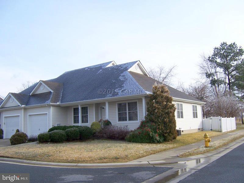Charming 1 Floor Corner Unit 2Bedroom/2Bath Townhouse has Living Room, Dining Room, Kitchen, Screened Porch, Walk-up Attic, and Garage.