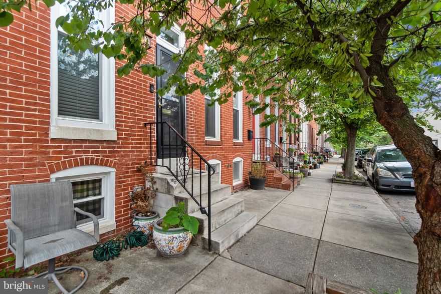 Beautiful 3 bedroom 2.5 bath home on great block in Canton with parking pad! This home has been completely renovated. Exposed brick, hardwood floors, crown molding and tall ceilings. Kitchen with white 42 inch cabinets, granite counters, stainless steel appliances and peninsula with seating for two. Dining room, half bath and laundry on entry level. Primary bedroom with en suite bath. Two additional bedrooms and half bath on upper level. Roof top deck with great views of the city! Deadline for offers is Monday, July 10th at noon.