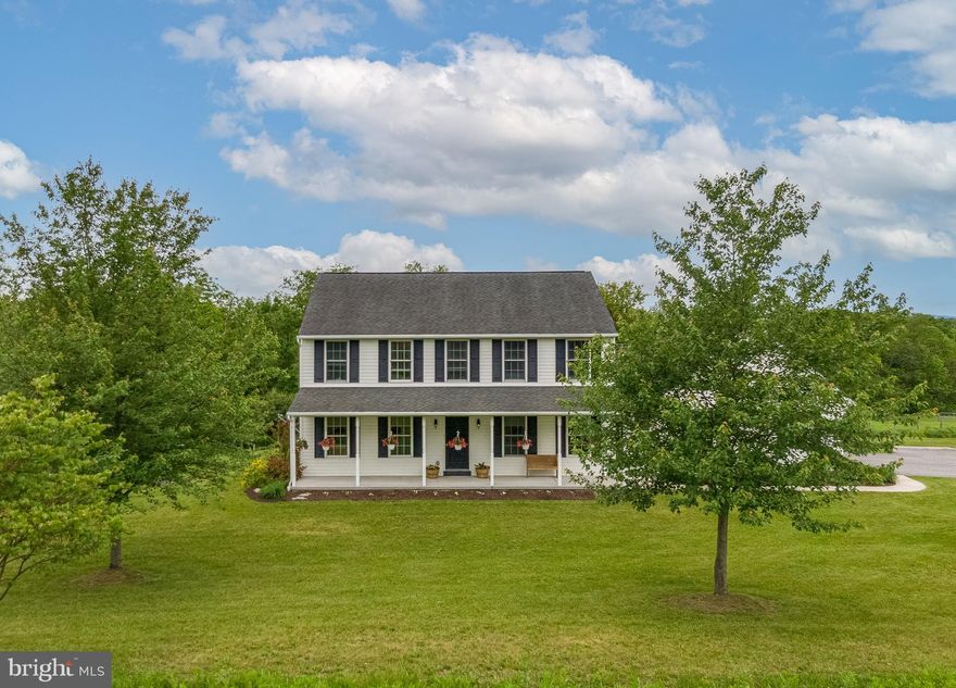 Welcome to 38 Seiger Lane, Shoemakersville, PA.    Nestled on over 14 serene acres in Berks County, this well-kept two-story home offers space, comfort, and a beautiful slice of country living. With 4 bedrooms, 2.5 bathrooms, and a practical layout, it’s ideal for anyone looking to enjoy life with a little more breathing room.  The main level features an open kitchen with generous counter space, cabinet storage, and a center island—perfect for everyday meals and casual gatherings. The formal dining room features a beautiful tray ceiling, adding a touch of elegance to holiday meals and special gatherings. There’s also a cozy, dedicated home office or library complete with built-in shelving—ideal for remote work, study, or a quiet reading nook. A first-floor laundry room and central air provide modern-day convenience. The detached multi-car garage adds flexibility for storage, hobbies, or equipment.  Enjoy panoramic views of the surrounding hills and farmland from the large deck and covered front porch. The gently rolling acreage includes a creek, a spring-fed pond, and 10+ acres of open pasture. Mature fruit trees, blueberry bushes, and a raspberry patch provide charm and seasonal harvests. Ideally situated in Perry Township, this location offers a peaceful rural setting while remaining conveniently close to shopping, schools, and major highways.  Enrolled in the agricultural preservation program, this country retreat benefits from reduced property taxes, making it an attractive investment. Whether you're dreaming of a hobby farm, an equestrian property, or just wide open space to enjoy the outdoors, this property offers room to grow and explore.