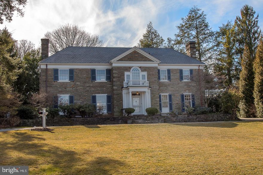 Cheswold Hill Road in Haverford leads thru beautiful grounds, gentle topography and among the Main Line's most gracious and valued houses in a neighborhood that only 100 years ago was Mrs. A.J. Cassat's beloved 54 acre sanctuary, 'Cheswold'.  234 Cheswold Hill Road is 10 minute's walk to the newly renovated Merion Cricket Club and SEPTA train station at Haverford, Haverford Square, Green Engine Coffee and Haverford College's beautiful campus, arboretum and nature trail.  The house is a prominent and dignified, three story stone manse of 6000 square feet with classical old world charm. Renowned builder Pasquale Beccia constructed this house as he did all his great houses along the Main Line - almost entirely of hand cut stone and slate. Thus, 234 Cheswold Hill has the best architectural pedigree, with features and qualities of the period, beginning with the location of the lot within the neighborhood. The grounds are in keeping with the house, including the generous scale and wide frontage of a large, deep premium lot.  High, rectangular east and west stone chimneys.  Master bedroom suite with sunny afternoon balcony overlook, private patios open all along the back of the house for indoor to outdoor living in season, with a fountain, pool and pool house with half bath and kitchenette. Three family rooms. Attached three car garage with easy turn out to double width driveway at the front that easily accommodates numerous or larger cars without any congestion or stress. All naturally sheltered from the bustle of busy roads and speedy cut thru traffic for truly peaceful living.Wide stone steps to the front door portico.  Enter the two story center hall with coat closet, elegant step up to the foyer with transverse hall, beautiful carved staircase and large, formal reception rooms. Hall to paneled library with fireplace, built ins and private veranda.  Powder room with both vanity and true WC. Large eat-in kitchen is white with white tile, granite tops, new floor, new stainless steel appliances, new double ovens, dual dishwashers and double sinks. Office command hutch, back door to patio. Back kitchen hall for basement, back door, maid's stairs and garages. Dining room has hand pegged hardwood floors, sunny landscape bay window wall to patio at rear, and opens to family / great room. Formal living room has hardwood floors, dentil moldings, gas fireplace, elegant windows to front views and opens beautifully thru two double doors to the rear-set family / great room, which easily completes excellent first floor flow for both daily family life and any seasonal entertaining or hosting requirements.Master bedroom suite allocates nearly half of the second floor.  Bedroom has fireplace and his and hers bathrooms, private roof deck and balcony, her dressing area in addition to the master retreat dressing room, all with large closets, beautiful hardwood floors and big bright windows. Large second floor landing at centennial window for beautiful natural light and privacy. Cross landing to two family bedrooms off smaller foyer, both with big windows and large closets, hardwood floors. Both share full, modern hall bath with twin bowl vanities. Back hall to oversize fitness or yoga studio or a teenager's family room, with half bath and laundry. Back stairs descend to kitchen.  Steps up to third floor with two more family bedrooms, both with beautiful hardwood floors, cozy, bright dormer windows and closets, both sharing full hall bath.  Attic storage.Lower level has third half bath, third family room with daylight windows and plush carpet, fourth fireplace and full service bar with wine storage and refrigeration.  Unfinished portion of basement has immense storage rooms, mechanicals, additional laundry location and two separate stair cases to first floor.Pool house has dressing area and half bathroom, kitchenette with microwave and refrigerator, storage.