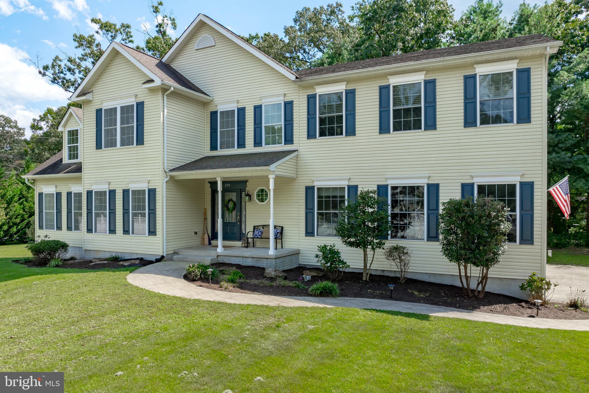 Welcome to 238 Old Magothy Bridge Road, a home designed to grow with you. This Multi-generational residence offers 5 bedrooms ,3.5 baths. a thoughtfully arranged for both comfort and flexibility. The main level features a private ensuite bedroom, perfect for guests or extended family. Upstairs, you'll find 3 additional bedrooms and a recently added expansive primary suite with a spa inspired bath, exercise room and it's own laundry. A screened porch sunroom off the kitchen extend the living space, creating the perfect spot for seasonal dining or relaxed family gatherings. the kitchen features stainless steel appliances, granite countertops, generous workspaces, and abundant storage with a sunny and cozy nook for casual dining. A quiet little den offers the perfect space for a home office, playroom or children's study area. An oversized attached garage with attached storage above along with a detached 2 car garage, provide ample room for vehicles , hobbies or workspace. Just off the sunroom , a spacious deck overlooks a fenced area for pets, along with a side yard that offers ample room for sports and outdoor play. Finally two added benefits round out this property: a third floor bonus room, perfect for flexible use, and a spacious basement with a rough -in for a bath and wet bar offering excellent potential for additional living space to suit a growing family.
