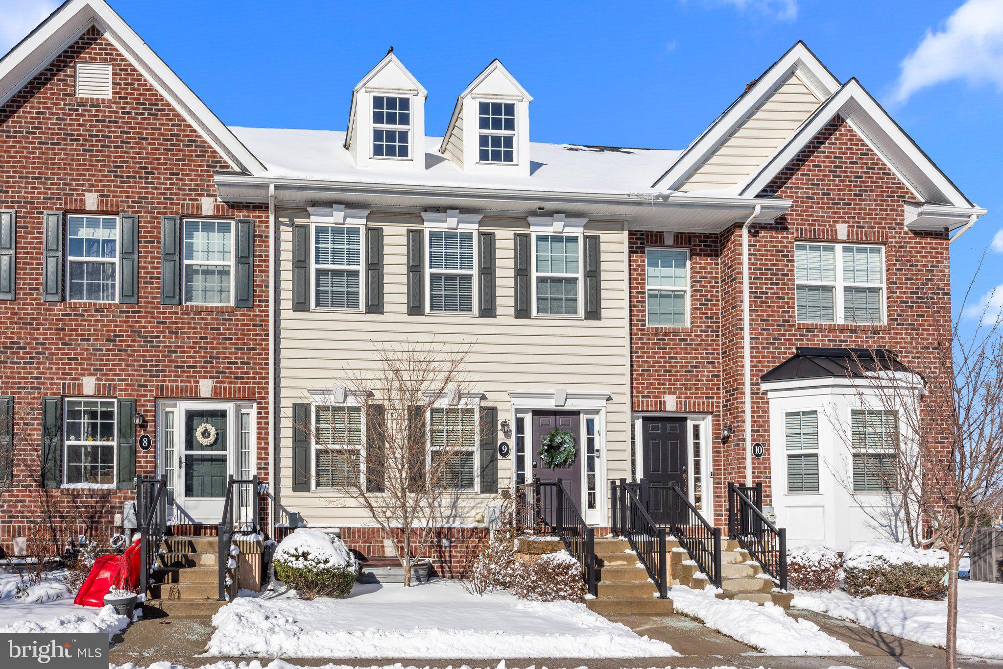 Welcome to the desirable community of Carriage Hill in Doylestown, where this stunning townhome offers the perfect blend of comfort and convenience. This home is thoughtfully designed, with recessed lighting in the kitchen and basement, as well as upgraded light fixtures in the living room, dining room, and bedroom #2, and a ceiling fan in primary bedroom. The spacious great room, with nine-foot ceilings, opens to the well-appointed kitchen beautifully appointed with 42" antique white cabinets, gleaming granite countertops, and stainless steel appliances, including a gas range, dishwasher, microwave, and refrigerator creating a functional yet inviting layout.  The 2nd floor features two generously sized bedrooms with large closets and two full baths. The finished basement includes a 3 piece rough-in plumbing for a future full bath, providing the opportunity to expand further.  The first floor boasts elegant hardwood flooring, and the full baths are finished with tile floors, extended-height vanities, and an expanded stall shower. Outdoor living is equally inviting, with a brick paver patio perfect for relaxing or entertaining. The home’s convenient location offers easy access to Routes 611 and 202, making it just a short drive from all the shops, dining, and attractions that Doylestown has to offer. With washer and dryer included and every detail carefully considered, this home is ready to provide comfort, style, and convenience in a sought-after community.