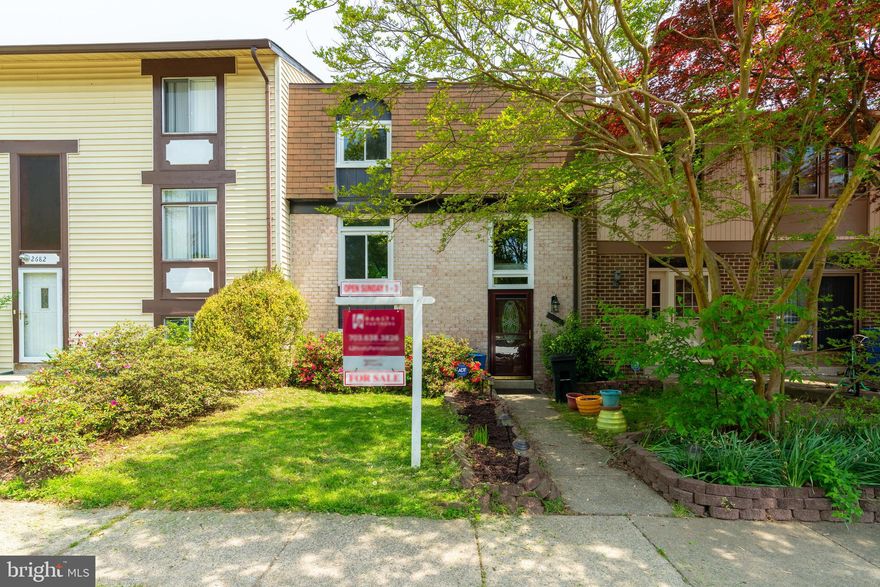 You will not want to miss this Lake Ridge town house. This home features 3 bedrooms, 1 full and 2 half baths. Living room and dining room with laminate flooring.  Living room and dining room with crown molding and chair rail. Finished walk out lower level with plenty of storage and wet bar. Fenced rear yard with deck perfect for entertaining. 2 reserved parking spots directly in front of home. All new windows. Roof 2016, new electric panel, hot water 2018, HVAC 2015.  Home sold AS IS. Come fall in love!