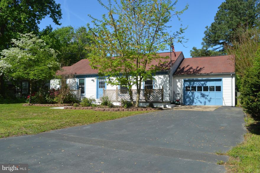 Get away to the beach at this 3 bedroom/2 bath with waterfront community amenities including a beautiful swimming beach, fishing pier and picnic grounds.  Move-in ready to enjoy this boating season!  Features attractive landscaping, paved driveway, garage w/finished bonus room, workshop/shed, fenced backyard.   Located in a golf cart community near the Town of Colonial Beach.