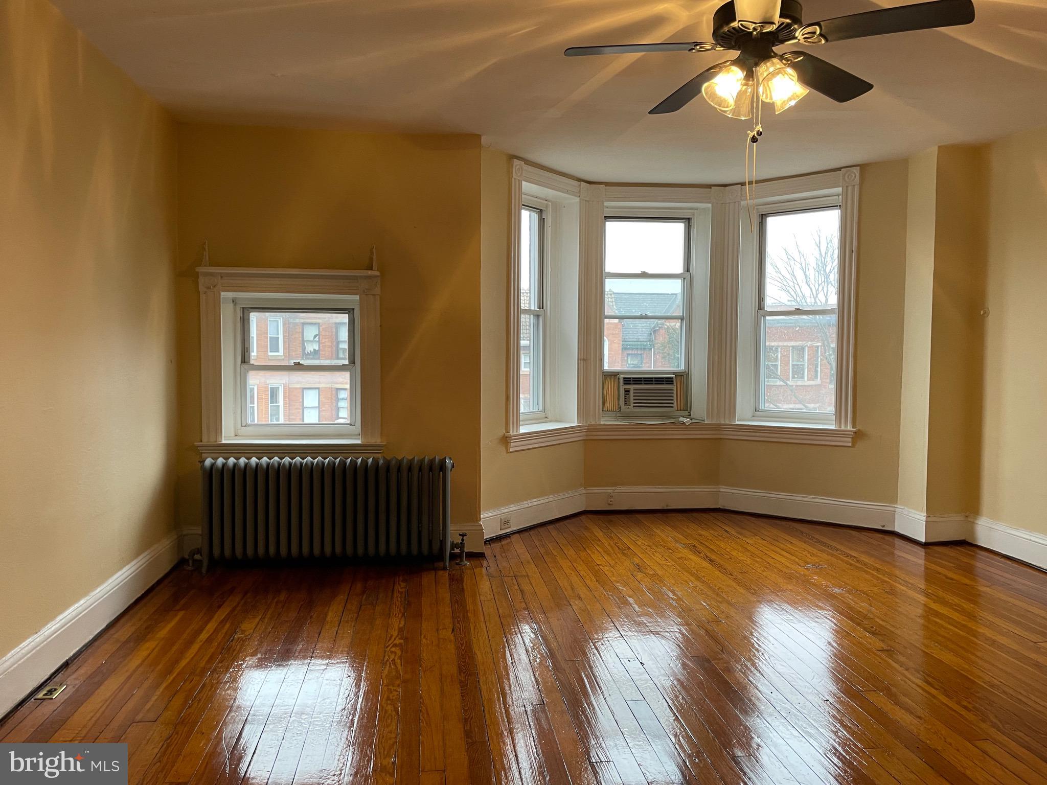 Circa 1897 Charles Village3rd floor flat offers many original details: bay (turret) window, wood floors, mantel, transoms, claw foot tub. Flexible layout features living room, dining room, galley kitchen, bath & 2 bedrooms. Situated just steps from a Hopkins Shuttle stop. Convenient to Penn Station, JHU Homewood campus, Union Memorial Hospital, shopping, cafes and restaurants. Includes one off-street parking space and free laundry in basement.