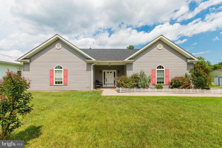 All the features you want in an affordable price range!  Located just north of the Virginia border in Bunker Hill, this 3 bedroom rancher is a real find with public water and sewer, high speed internet. and no HOA.  Chicken coop,  a large shed, and low maintenance privacy fencing is already in place plus a small garden and plenty of yard space for more.  It's one level living with no stairs and a level entry in this fresh and open, split floorplan rancher home.  The pitched ceilings and clear sight lines highlight desirable features and upgrades including a side load garage; LVP flooring and ceiling fan in every room; a modern eat-in kitchen with a pull-up island, full height cabinetry, and separate food pantry; and the private bedroom with twin closets and a modern en suite bathroom.  The large second bedroom has great natural lighting.  Plus the third bedroom has plenty of space for another full set of bedroom or office furniture.  Just built in 2020, this one is almost new and could be yours!