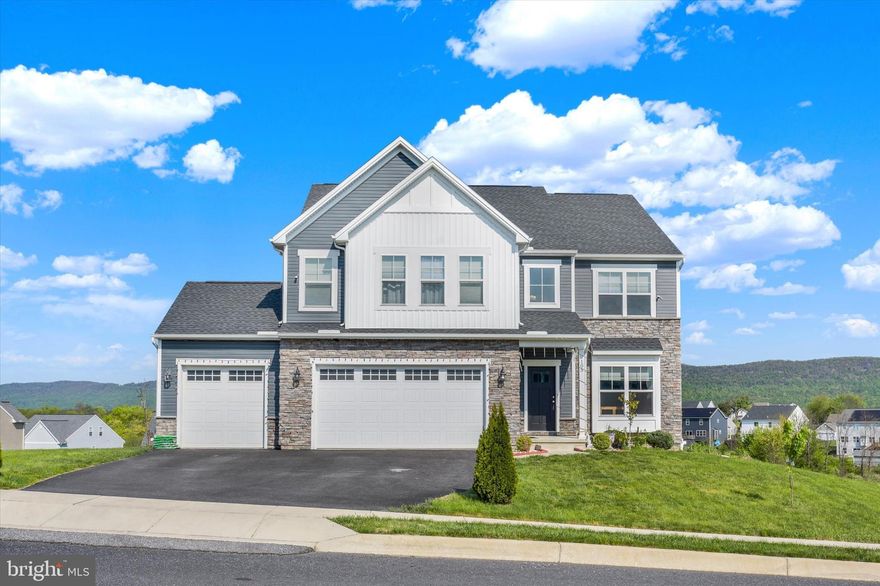 Welcome to this stunning home located in the Mountain View Estates community in Carlisle. Featuring 4 spacious bedrooms and 2.5 bathrooms, this home offers a blend of modern design, comfort, and timeless charm. Step inside to discover 9-foot ceilings on the first floor, creating an open and airy atmosphere—especially in the impressive great room, which is well-suited for entertaining. The gourmet kitchen is a true centerpiece, showcasing a striking navy blue island, granite countertops, tile backsplash, stainless steel appliances, and a large pantry. Luxury vinyl plank flooring flows throughout the first floor, leading into a spacious family room just off the kitchen—designed for flexible everyday living.

Upstairs, the owner’s suite offers a private retreat with an en-suite bath featuring a fully tiled shower, soaking tub, double vanity, and ceramic tile flooring. Additional bedrooms offer ample closet space, and a second-floor laundry room adds convenience. A versatile loft area provides flexible space for a home office, recreation, or lounge. The home also includes a three-car garage for parking and storage. The full walk-out basement provides access to the backyard, while a two-story deck enhances the outdoor living experience. Don’t miss the opportunity to make this well-maintained property your new home!
