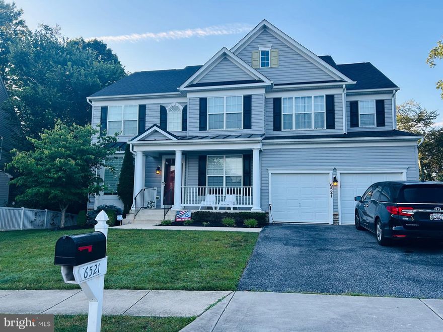 This stunning home offers 6 bedrooms and 5.5 baths, perfectly designed for comfort, style, and entertaining. The upper-level features 5 bedrooms, including a luxurious primary suite, while the lower level offers a guest bedroom with two full baths.  The light-filled walkout basement also boasts a large recreation room, a home gym and an extra room for flexible use, offering additional living and play space.  At the heart of the home, a spacious gourmet kitchen flows seamlessly into a warm family room, creating an inviting space for everyday living. A large dining room surrounded by windows bathes the space in natural light, ideal for hosting gatherings. Two dedicated home offices provide flexible work-from-home options.  Step outside onto the huge deck or covered patio overlooking a private, wooded lot, perfect for outdoor dining, relaxing, or entertaining.  Located in a wonderful family-friendly neighborhood, this home balances tranquility with convenience—ideal for modern living.