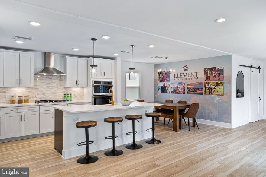 New Luxury 2 Bed/2 Bath with Study! Reserved garage parking space included! New amenity-rich 55+ community conveniently located near Rt. 50, mere minutes to downtown Annapolis, waterfront dining, shopping, Sandy Point & Bay Bridge. Beautiful design upgrades throughout, island kitchen with gas cooking, huge walk-in closet, private balcony at 2nd floor level in elevator building. Turnkey home includes window treatments, full-size washer & dryer, more. Must see!!