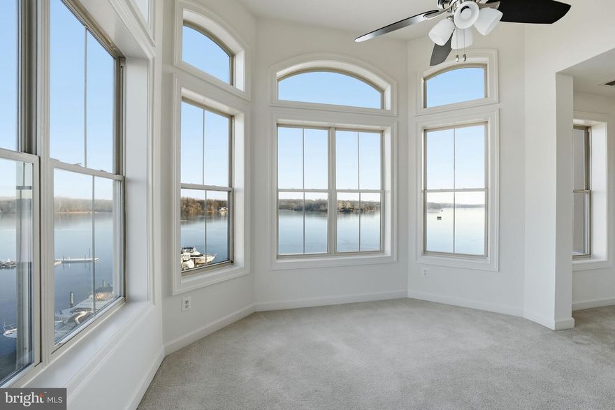 Looking for the perfect waterfront condo in Belmont Bay? Then your search is over. This beauty has it all.The only way to live any closer to the water in Belmont Bay is to be on in. Watch Bald Eagles, Osprey and amazing waterfront sunsets from your living room with expansive windows.  The Magellan floorpan in the largest one in the building and this top floor corner unit it offers the best views  the neighborhood has to offer from every window.  The kitchen is expansive with room for a table and offers both a pantry and built-in desk area.  Imagine waking up every morning in a primary bedroom overlooking the water.  Two nice walk-in closets and a primary bath make for a private retreat.  The guest room and bath are on the opposite side of the unit for privacy.  If you need a home office/flex space  this unit has it as well a  separate dining area.  Extra storage is available a few steps away in storage closet 4A.  Two deeded garage parking space and  shopping carts available to help you with your larger shopping trips .  New HVAC installed in 2023.    Belmont Bay offers events throughout the summer on the community green, miles of walking paths, and tennis courts. The commuter rail train is located in the community for easy access to Alexandria, Crystal City, Pentagon & DC..  Don't miss your opportunity to buy the best view in Belmont Bay.