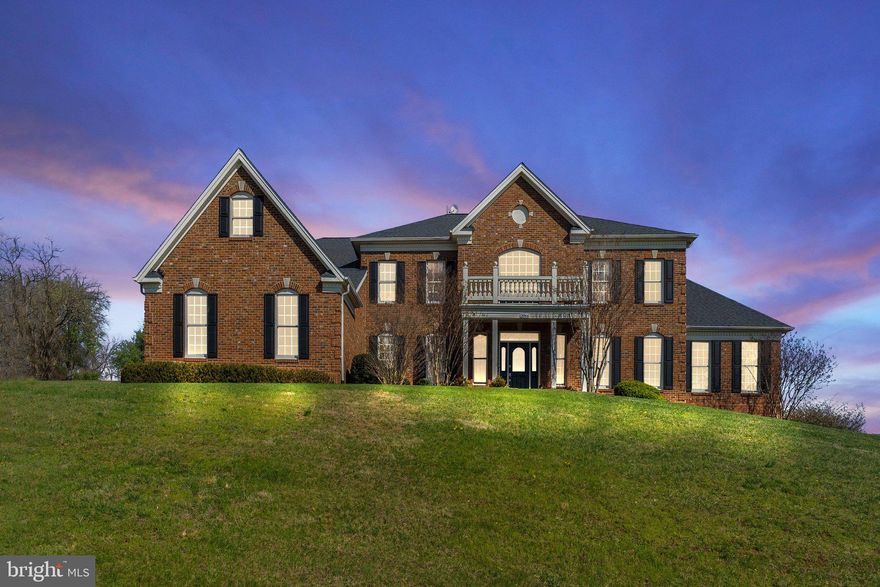 Luxury living with panoramic vista and mountain views!  This elegant home has three fully finished levels and a total of 8,100 square feet of refined living space. This home blends timeless elegance with modern comfort. The main level has expansive windows, soaring ceilings, and designer finishes throughout.  Enjoy preparing meals in the well appointed kitchen with oversized island, stainless steel appliances, granite countertops and plenty of cabinet storage space. The sunroom is a cozy place to enjoy morning coffee before heading to work in the main floor home office. The open design connects the kitchen, sunroom and family room, with a separate dining room,  large enough for big gatherings. This popular Toll Brothers "Hampton" model has a great floor plan for entertaining and everyday living.  The side sunroom is a quiet space that could be a second office or library with plenty of windows to enjoy the gorgeous views. Upstairs, the primary suite is an oasis with a dreamy stand-alone soaking tub, separate shower, two vanities and two separate water closets.  There is a large walk-in closet and an amazing closet room that extends over the three-car garage.  There are three more bedrooms, each with en-suite bathrooms.  The lower level is a another delightful surprise with 2,580 square feet of finished space including a workout room and full apartment complete with its own family room,  kitchen, wet bar, two spacious bedrooms, two full baths and a laundry room. Perfect for guests or multi-generational living. Every detail of this home has been thoughtfully crafted to offer style, space, and serenity. Noteworthy updates by current owners: Primary bathroom complete renovation, 2 new heat pumps, dishwasher, refrigerator, back yard fence and fire pit, carpet, interior painting, lower level bathroom renovated.  Roof was replaced by prior owner approx 2021.  Enjoy the sunsets from the back patio or the fire pit on top of the hill. Waterford Ridge is very near wineries, breweries, Historic Waterford, Lucketts or Purcellville. Dulles Airport is about a 30 minute drive. Washington, DC is about 30 miles. Love where you live!! Owner will need a rent back until end of August.