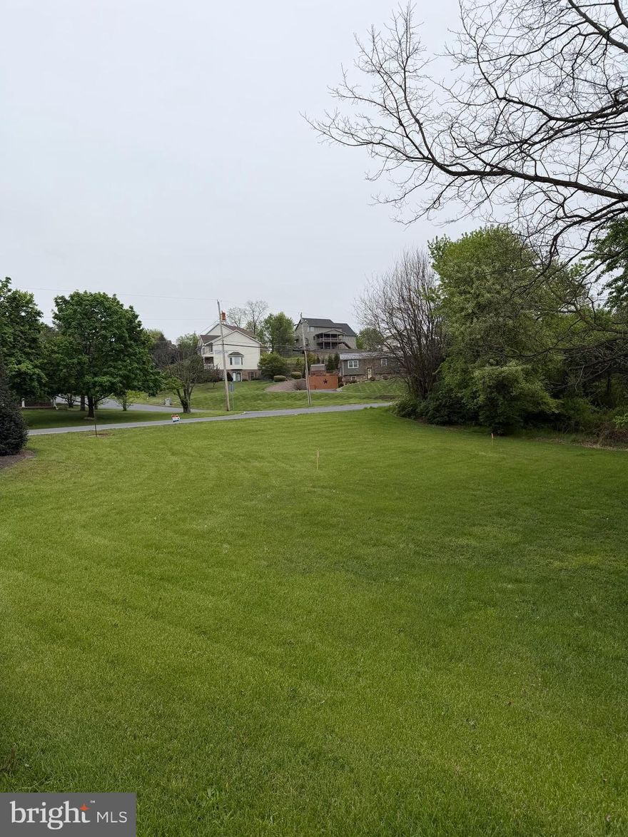 Beautiful  building lot with peaceful back yard along a stream.  Public water and sewer available .  Build your dream home