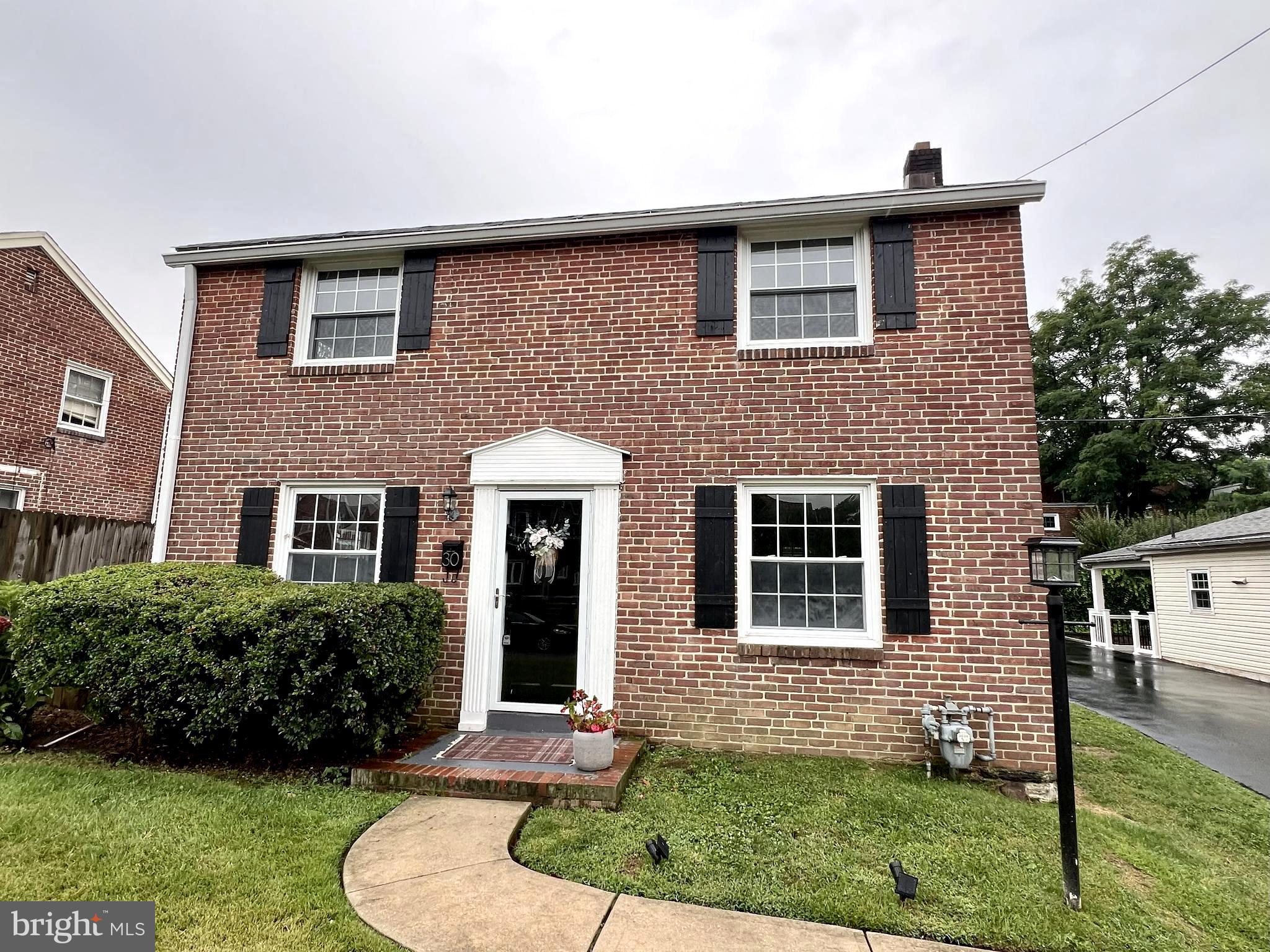 Welcome to 30 Wayne Avenue, a beautifully maintained brick Colonial nestled in Springfield’s sought-after Scenic Hills neighborhood. This inviting 3-bedroom, 1.5-bath home showcases original hardwood floors, a sunlit living room with oversized windows, a dining area, and a tastefully updated kitchen featuring granite countertops, stainless steel appliances—including a new refrigerator (2024) and dishwasher (2023)—and a center island with bar seating. Upstairs, you'll find three bedrooms and a full bath. Recent upgrades include a newer HVAC system (2017), water heater (2019), and fresh interior paint and French Drain installed and radon system. Step outside to enjoy the covered rear patio and fenced backyard—perfect for relaxing or entertaining. With a shared driveway, excellent location in the Springfield School District, and easy access to shopping, dining, public transportation, and major roadways, this move-in-ready home offers comfort, convenience, and timeless charm.