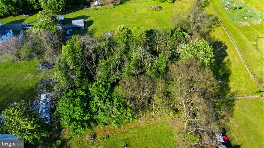 Secluded wooded lot on nearly half an acre in desired Bedington location, ready to build. This 0.48-acre unimproved lot offers a blank canvas surrounded by mature trees, set back for added privacy and a peaceful feel. Plenty of space for a custom home, outdoor living, or a private retreat. Enjoy a natural setting with minimal through traffic while still being conveniently located near I-81 and Spring Mills shopping and dining. A great opportunity to build with space, privacy, and flexibility.

If you’re looking for a place to build with space, privacy, and natural surroundings, this lot offers a strong opportunity to create something truly your own.