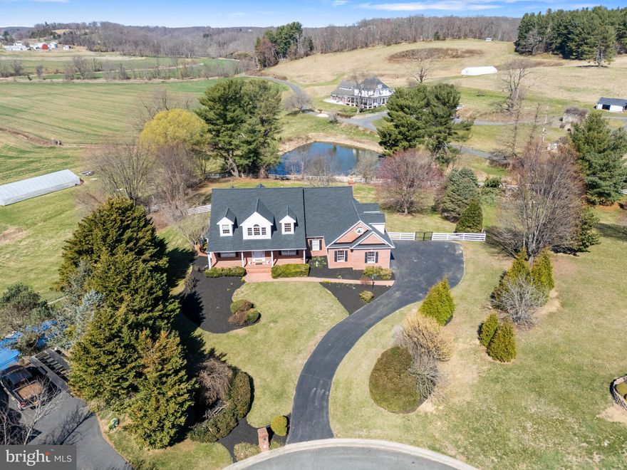 OFFERS RECEIVED, SELLER HAS SET A OFFER DEADLINE OF TUESDAY 4/8/25 AT 12PM.
Here It Is !! The Home You Have Been Waiting For !! This Absolutely Gorgeous, 5 Bedroom 3 1/2 Bath, All Brick Cape Cod, Nestled on 1.27 +- Acres, Features a Beautifully Landscaped Lot, and is Located in the Highly Desired and Rarely Available Woodshire Village Community in Street, Md. 
This Fine Home, Built By Renowned Builder Art Wood, Boasts over 5000 Square Ft. of Living Space, Allowing the New Owners to Spread Out and Relax in Comfort. 
As You Walk Up to The Home Via the Stamped Paver Walkway, a Covered Brick Front Porch Welcomes You. Upon Entering, You are Greeted by Gleaming Hardwood Floors,  a Open and Inviting Traditional Floor Plan, and a Beautiful Wooden Staircase Leading You to the Upper Level. The Formal Living Room, Formal Dining Room and Large Office With Built-In Bookcases are Inviting and Feature Plenty of Warm Natural Light. The Spacious Eat-In Kitchen is a Chef's Dream With Dual Wall Ovens, a Granite Island With Downdraft Gas Cooktop, and Corian Countertops. A Slider Walkout Off of the Kitchen Leads to the Wrap Around Deck, Which Overlooks the Private Fenced Rear Yard and Offers Fantastic Neighboring Pond Views. Also, Don't Forget the Oversized 2 Car Side Load Garage which Enters Into the Ceramic Tile Floored Laundry/Mud Room.
The Main Level Family Room Is Located off of the Kitchen and Boasts Cathedral Ceilings, a Stone Two Story Woodburning Fireplace, A Wet Bar with a Mini Fridge, and a Second Beautiful Wood Staircase Leading to the Upper Level. The Well Appointed Primary Suite with Sitting Area, Features a Ceramic Tile Bath with a Dual Vanity, Jetted Tub, and a Generous Sized Walk In Closet. Three Additional Nice Sized Bedrooms, a Walk Through Main Hall Bath, and a Spacious Bonus Room Round Out the Upper Level. The Lower Level Includes a Large 5th. Bedroom, a Full Bath, a Walkout Slider to the Rear Patio, a Utility Room, and a Enormous Unfinished Area Just Waiting For Your Ideas.
Recent Updates to Include a Brand New Architectural Shingle Roof With Transferable Warranty 2024, New Main Level A/C Unit 2024, New Hot Water Heater 2024, and a New Upper Level A/C Unit in 2019.
This Fantastic Home Has a Country Location With Incredible Views, Is In North Harford's Blue Ribbon Schools, and is Perfect For Easy Commuting, Shopping, and Dining. Schedule Your Showing Today !!