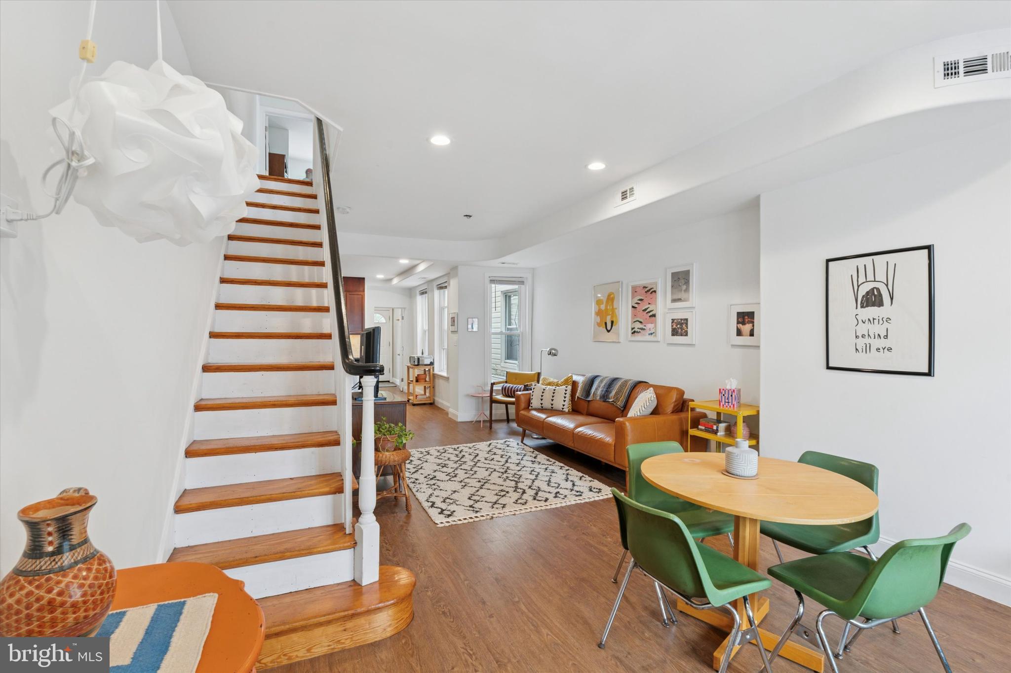 Nestled on a highly sought-after block in the vibrant Port Richmond neighborhood, the beautifully crafted three-bedroom, one-and-a-half-bath home at 3418 Almond Street offers an exceptional living experience. Its inviting front porch, perfect for enjoying warm days on rocking chairs, sets the stage for the thoughtfully designed open-concept interior. Step inside to discover a sun-drenched first floor, graced with newer flooring throughout, a conveniently situated powder room, and a dedicated laundry area. The heart of the home is its entertainer's dream kitchen, boasting stainless steel appliances and a generous pantry with ample shelving, which flows seamlessly into the dining and living rooms. Upstairs, the second floor hosts three comfortable bedrooms and a newly remodeled full bathroom. The primary bedroom is a true retreat, featuring dual closets for extensive storage. Additional highlights include a private backyard space, ideal for relaxation or outdoor gatherings, and a spacious basement providing abundant storage solutions. Don't miss this outstanding opportunity to reside on the desirable 3400 block of Almond Street, offering both a charming residential feel and convenient access to I-95, placing the best of Philadelphia within easy reach.