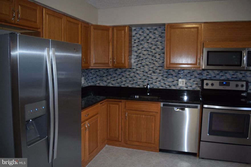 Spacious Townhouse in quiet  cul-de-sac, back to trees. kitchen updated in 07/2017 with granite counters & SS appliances. A/C and Heating system replaced in 2015. Large easy maintenance backyard. Nice den for office/gym or 4th bedroom in  basement. Easy parking. Walking distance to Great Schools, Buses, swimming pools, Tennis courts and basketball courts. Near to Shopping, dining, VRE Station.