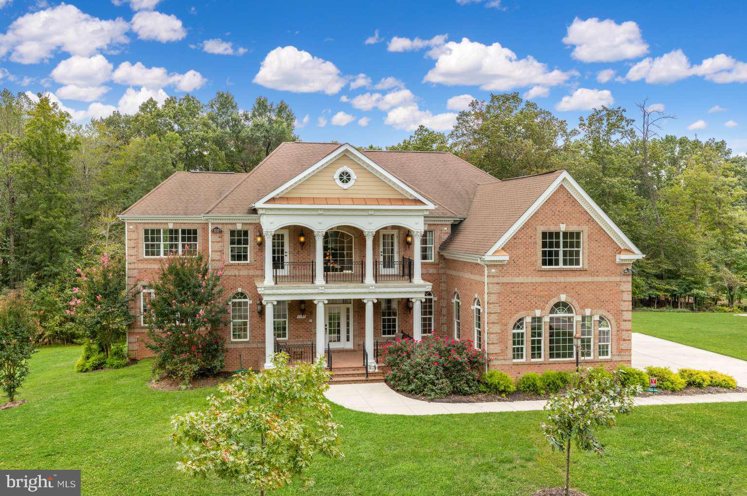 This is a once in a lifetime opportunity to own a true one of a kind masterpiece. This home was build with no barrier to cost. It was the personal home of a second generation custom home builder who has built over 150 custom homes in Northern Virginia alone. This approx 9100 finished sqft (including basement) 8.5 bath home boasts 4 fireplaces, 6 skylights, 4 master bedrooms, three second story balconies, 1 main monogram chefs kitchen and 8 additional wet-bars/breakfast bars. There are too many recesses lights, ceiling fans and flush mount lights to count. The main master has a shower that has 9 different shower heads, a fireplace, a steam room, illuminated tray ceilings, breakfast bar, a custom tub and two toilets. The home boasts rare hardwoods, onyx floors and sinks, marble and travertine throughout. The second floor masters have 13' ceilings in the trays. There are 7 coffered and illuminated tray ceilings. There is no detail that is over looked in this true one-of-a-kind master piece. All offers in by the end of October 2024