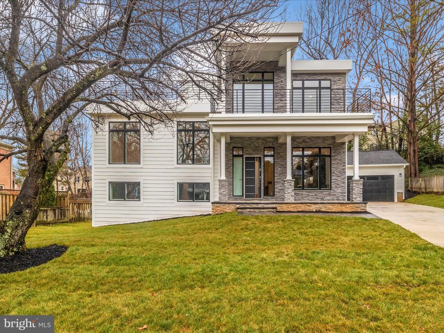 $100K PRICE REDUCTION! Welcome to your dream home! Over 3500 sq feet of living space, nestled in a serene neighborhood, this stunning residence has been meticulously renovated from top to bottom, offering unparalleled luxury and comfort. With attention to detail at every turn, this home is a true masterpiece of modern design. Walk into a beautiful spacious gourmet kitchen with hardwood floors, Thermador appliances, and  large island with counter space for 6. The back has a bump out perfect for a breakfast nook overlooking the backyard and paver patio. The top level boasts two ensuite bedrooms with large windows. Primary bedroom has a balcony, his and hers walk in closets, and beautiful bath with soaking tub. Total of 4 bedrooms on upper levels, laundry upstairs and a showstopper rooftop deck. The lower level has a charming family room with exposed brick wall, fireplace, bedroom with walk out access and full bath. Detached two car garage is wired for electric car hookup. House has a top of the line speaker system and wired for easy internet install.  If you love outdoor spaces and entertaining this home is a dream. No HOA and quiet street. America Trust Funding offering $10,000 credit to qualified buyers.