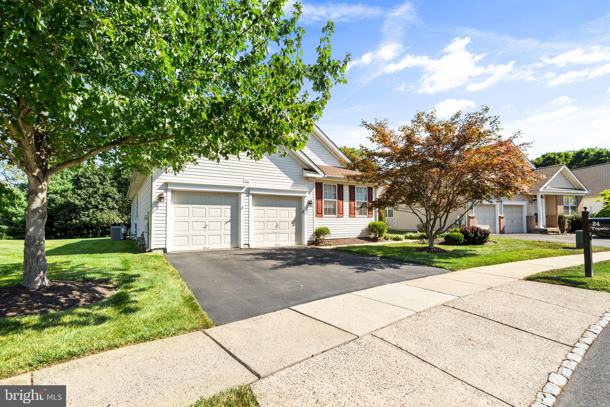 Welcome to 24 Tupelo Lane located in the sought after section of Flowers Mill Langhorne. Experience refined living in this sought after over 55 single,blending elegance, comfort, and thoughtful design . The heart of the home is the expansive eat in kitchen, perfectly paired with a formal dining area ideal for entertaining. The impressive living room opens to a private deck through patio doors, complete with an automatic awning for shaded enjoyment. A versatile office or den offers the perfect retreat for work. The luxurious primary suite boasts two closets and a spacious ensuite bath,while a second appointed bedroom is served by a full hall bath. A convenient laundry room provides direct access to the lower level. The basement is a true extension of the living space-three three quarters finished with a family room,hobby room,powder room, and dedicated work space,all anchored by a massive walk in storage room with built in shelving. An oversized 2 car garage and a newer HVAC system and roof completes this exceptional home. Beyond the home,enjoy the lifestyle this active community provides-clubhouse,indoor and outdoor pools,tennis courts,pickleball courts,walking paths,and lawn care services-all designed to make every day feel effortless. This exceptional property offers the perfect balance of upscale living and worry free amenities tailored to today's active lifestyle. Call today for your private showing.