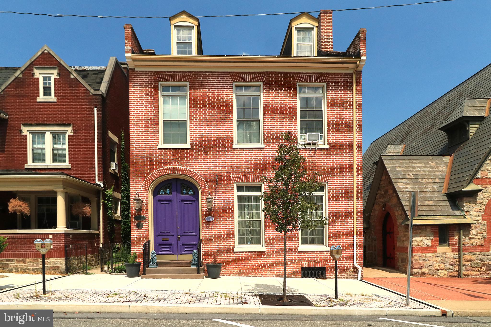 OPEN HOUSE - Thursday, September 18th, 4:30 - 6:00 PM. Step into a world where history and elegance intertwine at this iconic pre-Civil War residence, located in the heart of downtown Lewistown. The Benedict Mansion House, a distinguished city-colonial home, stands as a testament to the past and was once the residence of Lewistown’s first female Postmistress. Lovingly preserved, this historic gem, with its commanding presence on Main Street, offers a rare blend of timeless charm and modern updates. Inside, the grandeur of 14-foot ceilings and original plank flooring immediately captivates, while five fireplaces - three wood burning and two with electric inserts - and intricate, antique finishes evoke the feeling of a royal retreat. The home boasts numerous custom details, including bespoke curtains, carefully designed bathrooms, and handcrafted doors, all thoughtfully added to enhance its historic beauty. With 4 spacious bedrooms and 2.5 full baths, there's plenty of room to relax and unwind. The finished attic space offers additional versatility, ideal for a home office, playroom, or extra storage. The fully usable basement adds even more potential for living, recreation, or storage needs. The updated kitchen is a chef’s dream, featuring a Butler’s pantry that offers ample room for culinary creativity and entertaining. Outdoors, the private, fully fenced backyard offers a peaceful oasis, ideal for relaxation or gatherings, with a lovely patio perfect for hosting. Off-street parking is no problem with a detached semi-enclosed carport included. This one-of-a-kind home is a must-see for anyone who appreciates rich history, luxury, and custom craftsmanship.