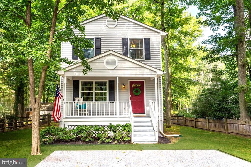 Charming cottage situated on shaded lot in Bay Highlands. The welcoming red door leads into a center hallway that flows seamlessly to the dining room, living room, or straight through the glass sliding door and out to the expansive deck for entertaining. Home is beautifully maintained with updated kitchen and baths.