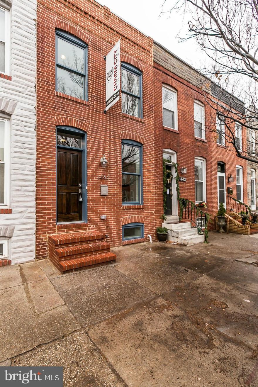 Complete rehab by Charm City Builders in Locust Point! Updates include all systems, new hardwoods, custom tiling in the bathrooms & a gourmet kitchen w/stainless appliances. Upper level has stunning, large master bedroom with spa like en suite bath.   Finished lower w/ rec room, bedroom & full bath!  Roof top deck with incredible city views.  CHAP tax credit.  PARKING included!  Just stunning!