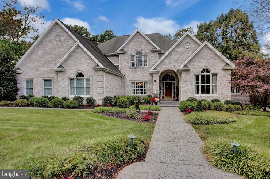 A MOST EXCEPTIONAL PROPERTY! CLASSIC BEAUTY WITH PERFECT FLOOR PLAN APPOINTED WITH EVERY DESIRABLE FEATURE THAT MAKES THIS THE PERFECT HOME. THE 2 STORY VAULTED ENTRY FOYER ENTERS INTO GREAT ENTERING LIVING SPACES TO INCLUDE FORMAL DINING ROOM WITH TRAY CEILING, CERAMIC FLOORING, MUSIC ROOM (WITH VAULTED CEILING), LARGE WINDOWS AND HARDWOOD FLOORS, THE LIVING ROOM OFFERS 2 STORY CEILING, GAS FIREPLACE, LARGE WINDOWS. WELL DESIGNED KITCHEN FEATURES ABUNDANT CUSTOM CABINETRY, GRANITE COUNTERS, BAR SEATING AREA, VEGGIE SINK, DUAL CONVECTION GAS RANGE, GLASS FRONT CABINETS, 2 DISHWASHERS, AND 2ND OVEN. THE ADJACENT FAMILY/KEEPING ROOM HAS LARGE WINDOWS AND BEAUTIFUL FIREPLACE, AND OVERLOOKS A LARGE COVERED DECK/PORCH WITH GAS HOOK UP. THE MASTER SUITE FEATURES A TRAY CEILING, GAS FIREPLACE, CROWN MOLDING RECESSED LIGHTING, 2 VERY WELL LARGE ORGANIZED WALK-IN CLOSETS. THE LUXURIOUS MASTER BATH HAS A COPPER SOAKING TUB, TILE SHOWER WITH PEBBLED FLOOR, DOUBLE VANITIES, CERAMIC FLOOR, COMPARTMENTALIZED WALK-IN CLOSET AND ITALIAN TILE FLOOR. THE GENEROUS SECOND LEVEL BEDROOMS ARE SPECTACULAR SIZES, EACH WITH FULL BATHS AND HUGE WALK IN CLOSETS. THE FINISHED WALKOUT LOWER LEVEL FEATURES FIREPLACE, GAME AREA, 5TH BR AND FULL BATH. BONUS CLIMATE CONTROLLED WINE CELLAR IS THE PERFECT FINISHING TOUCH. BEAUTIFUL OUTDOOR LIVING SPACE OFFERS HOT TUB, OUTDOOR KITCHEN PATIOS. FIREPLACE AND OVERLOOKS A 1.42 ACRE WOODED LOT FOR COMPLETE PRIVACY. THIS ALL BRICK BEAUTY IS A PLEASURE TO INSPECT. RECENTLY IMPROVEMENTS. NEW GARAGE DOOR OPENER, NEW SECURITY SYSTEM WITH 3 CAMERAS AND RING. NEW WATER SOFTENER SYSTEM AND FRESHLY PAINTED IN SOME ROOMS.