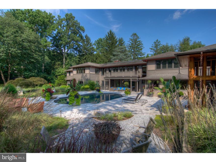 Welcome to this hidden gem that is gracefully immersed on two of the most private, serene, and breathtaking acres you have ever seen in Radnor Township. The architectural evolution of this magnificent property bagan as a pool house, to a ranch, and then was completely transformed by its current owners into the masterpiece that it is today!! Their vision was a carefully choreographed progression and use of materials that connects the home to its landscape, and only once you get inside do you get a glimpse that will blow your mind. From the moment you enter you get a sense of this paradise where Living and Dining Room spaces have been reimagined and unified by an open floor plan with soaring ceilings and glass walls that effortlessly connect indoor and outdoor living spaces. Natural light floods this core of the home capturing the exquisite resort-like pool, two story screened in porch, and backyard oasis, while magically carrying you into two separate wings, dividing the family friendly spaces and private First Floor bedroom suites. There is a natural progression from the Office, to gourmet Kitchen, Breakfast Room, into sunken in Family Room, Mud/Utility Rooms and attached 3 car Garage. Some of exceptional features are cork flooring, stainless steel countertops, commercial appliances, magnificent cabinetry with built-ins, and river rock flooring. The adjacent wing has two generously proportioned Bedrooms, Hall Bath, and fabulous Master Bedroom suite with spa-like Bathroom retreat. A stunning brazilian cherry staircase transcends one to the Second Floor where a bridge spans the entire length of the house unifying both wings creating a gallery that overlooks the amazing backyard. Each wing has 2 Bedrooms with adjoining Baths, and two additional fantastic Bonus Rooms with many possibilities like...office, game room, studio. This architectural wonder is like no other property on the Main Line so if you are looking for something truly special don't let this one slip away!!