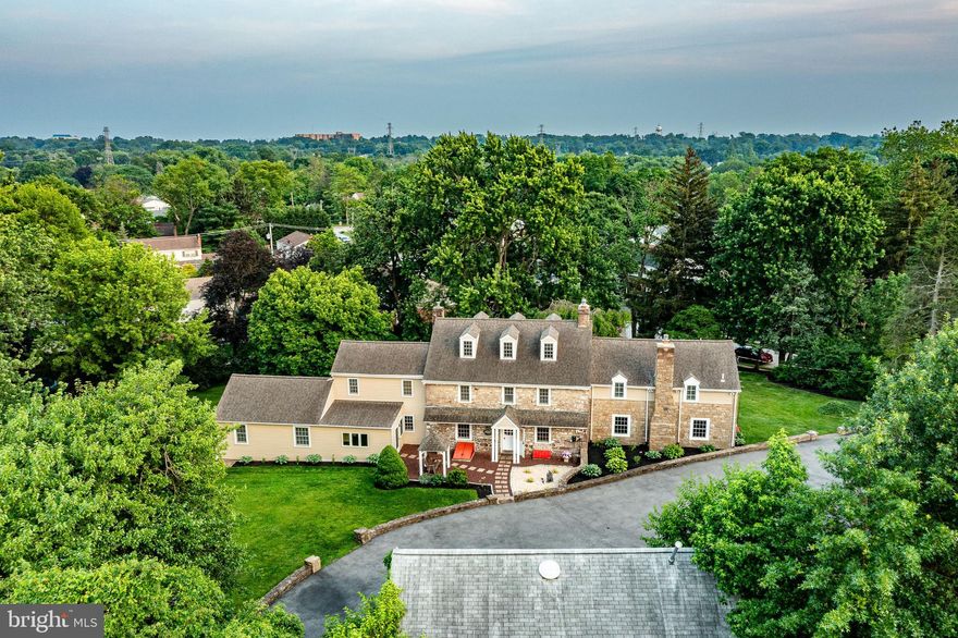From the moment you step into 349 Brighton Road, it feels like home. This fieldstone farmhouse, established circa 1847, was thoughtfully expanded in the mid-1900s to suit modern living while preserving its historic charm. Set back from the main road, the home offers exceptional privacy, and the spacious driveway provides easy access to both the main house and the carriage house.

With over 5,400 square feet of living space, the home features a sought-after in-law suite, three fireplaces, four full and one half baths, multiple bedrooms, a library, and a sunroom—just a few of the standout highlights. Each room is generously sized and flows effortlessly into the next, exuding character throughout.  

You’re welcomed by a large, sun-filled foyer with closets and a half bath. The expansive eat-in kitchen is a chef’s dream, outfitted with high-end appliances, a wine refrigerator, a hookup for a second dishwasher, and abundant cabinetry and counter space. A second staircase off the kitchen leads upstairs and provides direct access to the in-law suite.

The living room includes a built-in bar, custom shelving around the fireplace, and double doors that open to the rear patio, where you'll find a hot tub and access to the sunroom. Upstairs, four large bedrooms await—two of them with en-suite baths. The primary bedroom features multiple closets for ample storage.

The in-law suite, with its own entrance, includes two bedrooms, a full bath, kitchen, laundry, and living room—perfect for extended family, guests, or an au pair.

Modern updates, including electrical, plumbing, and solar panels, ensure 21st-century comfort.

Set on over an acre in the coveted Colonial School District, this home blends old-world charm—think Dutch doors, original locks, deep windowsills, and a historic spring house—with thoughtful updates. The carriage house, partially renovated by the previous owner, offers even more potential.
*Home Warranty Included"

Conveniently located just minutes from plenty of shopping, restaurants, recreation, parks and major highways, this home offers space, character and location.

Carriage House/Garage and Spring House are in as-is condition