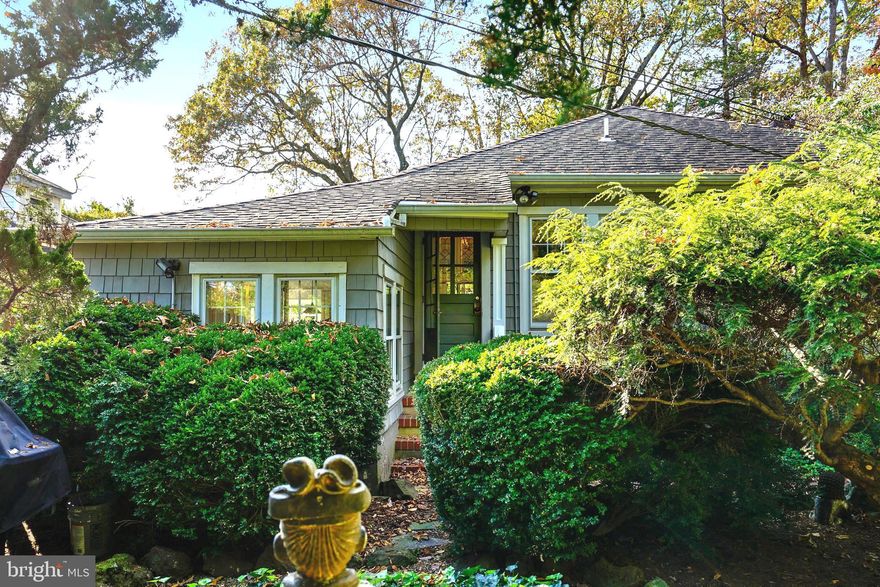 Freshly redecorated &tucked away on a very private .6 acre, wooded and beautifully landscaped lot, sits this astonishing  house in West Annapolis*** The exterior features fishponds, a brick patio, specimen trees and an herb garden***Selected to appear in the book 'Spectacular  Homes of Greater Washington', this home sits down a long private azalea trimmed circular driveway minutes from downtown, the shops of West Annapolis and Route 50.***The interior is as interesting as the exterior***The house has 9+ foot ceilings, richly stained  oak floors and enormous windows on all sides***There are 2 gas fireplaces, one in the living room, and one in the master bedroom***There are surprising architectural details, everything done for owner convenience with maximum appeal***There are 2 bedroom; one has been converted to a sumptuous dressing room yet could easily be re-adapted***There are 2 full bathes. one with a walk-in shower with rain forest faucet***The updated kitchen is charming with windows on 3 sides***There is a large full basement with abundant storage which can be accessed by stairs from the kitchen or an outside entrance***This is a small yet sophisticated unique house***Rather than cheek by jowl condo living, this home offers the exclusive opportunity for a one-of-a kind living experience***When visiting the house, you can park on Kirkley by the mailbox, but look for the hidden driveway for a more dramatic entrance!