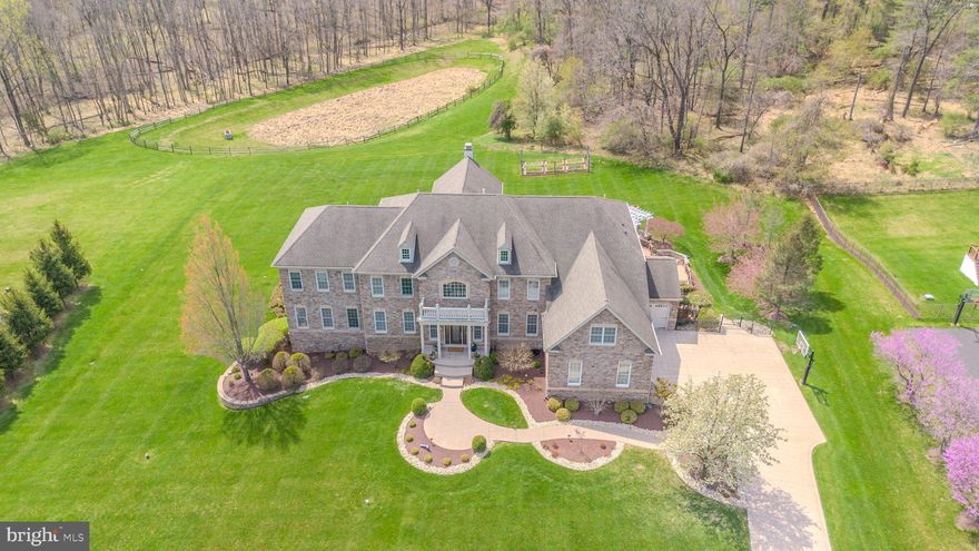 Experience unparalleled elegance in this custom-crafted estate in Upper Makefield’s premier Dutchess Farm Estates. Bathed in natural light and offering stunning sunset views, this residence blends meticulous craftsmanship with modern luxury. 

The open-concept main floor features a two-story family room and a gourmet chef’s kitchen with premium appliances. A rare main-floor guest suite and a sun-drenched conservatory add to the home’s versatility.

The second level is anchored by a massive owner’s retreat featuring a private gym and four additional en suite bedrooms. Storage is elevated by custom cabinetry and designer closets throughout. 

The finished walk-out lower level is an entertainer’s dream, boasting a full media room, a second high-end kitchen, and a 7th bedroom.

The exterior is a private resort featuring a covered patio, elegant pavilion, and a professional kitchen garden for "farm-to-table" living. 

Located in the award-winning Council Rock School District, with easy access to fine dining and boutique shopping. This is more than a home; it is a lifestyle.