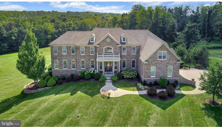 Experience unparalleled elegance in this custom-crafted estate in Upper Makefield’s premier Dutchess Farm Estates. Bathed in natural light and offering stunning sunset views, this residence blends meticulous craftsmanship with modern luxury. 

The open-concept main floor features a two-story family room and a gourmet chef’s kitchen with premium appliances. A rare main-floor guest suite and a sun-drenched conservatory add to the home’s versatility.

The second level is anchored by a massive owner’s retreat featuring a private gym and four additional en suite bedrooms. Storage is elevated by custom cabinetry and designer closets throughout. 

The finished walk-out lower level is an entertainer’s dream, boasting a full media room, a second high-end kitchen, and a 7th bedroom.

The exterior is a private resort featuring a covered patio, elegant pavilion, and a professional kitchen garden for "farm-to-table" living. 

Located in the award-winning Council Rock School District, with easy access to fine dining and boutique shopping. This is more than a home; it is a lifestyle.