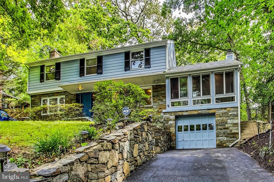 Welcome to this sprawling  4-bedroom with one of the bedrooms being used as the primary bedrooms walk in closet. Boasting 2 full and 1 half bath, this spacious residence offers the ideal blend of comfort and functionality. A versatile office and a cozy den provide ample space for work and relaxation. Enjoy the serene outdoors in the screened-in porch/room, while the wood floors throughout add warmth and character. The open kitchen/dining room layout with floor-to-ceiling windows is perfect for gatherings and culinary adventures. Nestled on a tranquil wooded lot, the property offers both privacy and a connection to nature. A large partially finished basement presents opportunities for customization, while the attached garage ensures convenience. The backyard with its deck is a canvas for outdoor entertainment and relaxation, completing this inviting and adaptable home. Close to Sligo Creek,  Downtown Silver Spring, 495, Metro, Trader Joe's, Whole Foods, YMCA and so much more.
