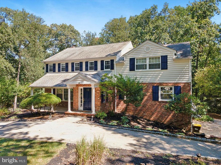 Welcome to this rare Main Line treasure — a stunning seven-bedroom, four and a half bath Colonial that beautifully combines timeless character, modern updates, and flexible living for today’s lifestyle.
Step up to the covered front porch, the perfect place to unwind and enjoy quiet mornings. Inside, you’re welcomed by a bright and spacious living room that flows effortlessly into the open family room and kitchen, creating an inviting, connected layout. The family room features a cozy fireplace and abundant natural light, beautiful built-ins — perfect for gatherings and relaxation.
The dream kitchen serves as the heart of the home, boasting an impressive 8-foot center island, quartz countertops, a new stainless steel range with hooded exhaust, and high-end appliances.  A wet bar, pantry closets, and a full laundry room add functionality and style, while a seamless connection to the formal dining room makes entertaining a breeze. Through the kitchen, step directly out onto the expansive Trex deck, overlooking your acre-plus private lot — the perfect extension of your living space. The Open concept of the kitchen to the outside is truly stunning. 
Outdoors, you’ll find a sparkling in-ground pool, surrounded by a paver patio and lush, manicured landscaping. Whether you’re entertaining guests, relaxing after a long day, or enjoying summer barbecues, this backyard oasis offers the ultimate private retreat.
Upstairs, the primary suite is a true escape, featuring large windows, a walk-in closet, and a spa-inspired ensuite bath with a jetted jacuzzi tub, tiled shower, and plenty of natural light. The additional five bedrooms on this level are spacious, bright, and equipped with large closets, sharing a beautifully updated hall bath.
The finished lower level includes a spacious living area for the main home, complete with a full bath and access to the attached two-car garage. Beyond this area lies the impressive in-law suite, offering a perfect combination of comfort and privacy. The suite features its own private entrance, a large kitchen, a sun-filled living room, a primary bedroom with laundry, and a fully renovated en-suite bathroom, plus a second bedroom with access to a full hall bath. The in-law suite also includes a dedicated one-car garage with a separate private entrance into the home. 
This home truly has it all — seven bedrooms, multiple living spaces, designer finishes, and resort-style outdoor living — all set on a beautiful private lot in one of the Main Line’s most desirable locations.
Don’t wait to schedule your appointment — all interior photos will be published Thursday!