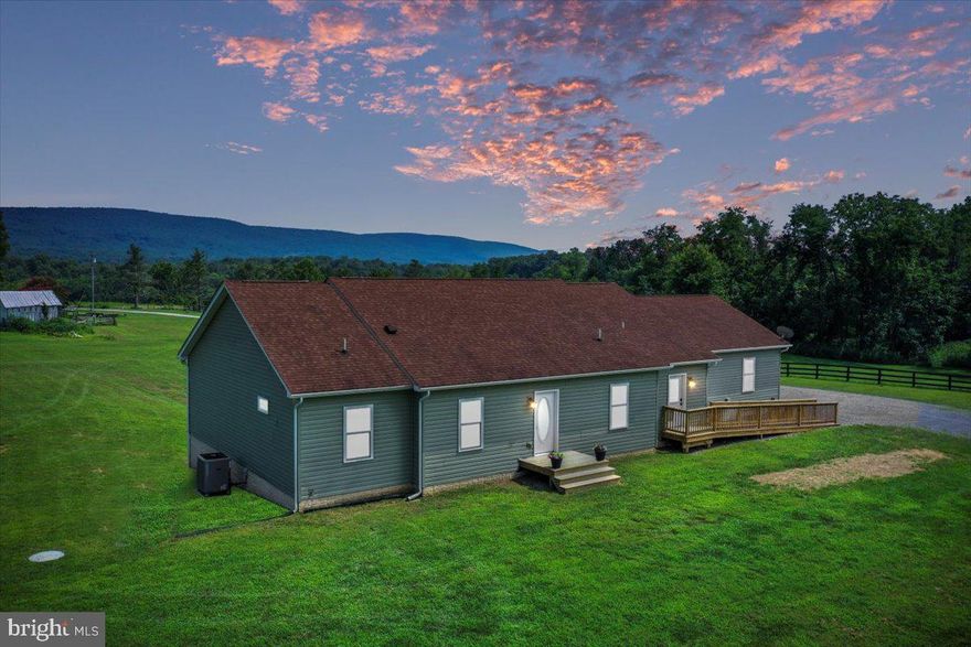 Set on almost 5 Acres with breathtaking views of the Blue Ridge Mountains, this property has both open lawn and roughly 3 Acres of navigable wooded land. This small neighborhood, accessible via John Rissler Rd that runs along the Shenandoah River and up a private drive, has NO HOA! 470 Frys Ln is the last property at the top of the lane, and features a 2017-built ranch style home with a finished walk-out basement (with 2nd kitchen!) A separate 22x36 metal barn w/ 2 roll up doors and its own 100 amp electric panel w/ 50 amp RV outlet gives loads of storage beyond the oversized 2-car garage!

The main house has several handicap accessible features, including an entry ramp, 36in doorways, and a chairlift to the basement. Once inside, you’ll find a wide-open main living area with oak floors and views out to the mountains. A 12x29 deck accessible from the living/dining area is perfect for gatherings at any time of day to enjoy the view, thanks to the remote retractable awnings overhead. Back inside, the kitchen is the heart of the home and laid out for entertaining! Featuring a center island w/seating, an extended counter and bar top w/ even more seating, and a coffee bar/ pantry area w/ beverage fridge, this space was designed for function. Granite counters, 42 in cabinets, pot filler over the stove and stainless steel appliances top off the upgrade list! 

The nicely-sized primary suite has desirable features like a barn door entrance, large bathroom with double sink and extended vanity, walk-in shower, room for a soaking tub and large walk-in closet. On the other side of the living area are two secondary bedrooms, a full bathroom, and mudroom with laundry and a tiled dog wash shower! The oversized garage (27x28) is accessible from this side of the house, and has pulldown stairs into the overhead attic for extra storage.

Through the living room and down the stairs (accessible by optional chairlift) you enter the finished walk-out basement that can be used as separate in-law living quarters, or just a really fun family/game room and guest space! There’s a full kitchen, 2 large bedrooms, bathroom with whirlpool tub/shower combo, large closets, LVP flooring, and 2 spacious unfinished storage rooms! 

Additional features like 2x6 walls, 2x 200 amp electric panels and full-house smart generator make this the perfect forever home in the country to call your own!

PRIDE OF OWNERSHIP- Construction not quite finished in basement - Walls in the basement living room are being finished this week, as well as drywall patching and remainder of paint. Entire home is being painted!