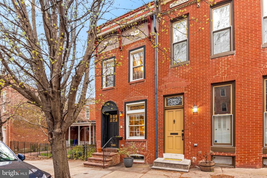 Timeless Butcher's Hill home encompasses the modern amenities the most discerning buyer will appreciate while maintaining the historic charm that makes this neighborhood special and property unique.  This 3 bedroom, 3.5 bath, lovingly renovated property has almost 4000 finished sq ft yet has  a cozy feel with warm natural light throughout.  As soon as you enter you are greeted by the walnut floors and multiple working fireplaces in the main living area.  A chef's eat-in kitchen features an oversized panoramic door that fully opens to the outside and lower private deck.  The home has well sized bedrooms including the large primary bedroom with ensuite marble bath featuring double vanities, jetted soaking tub and large shower.   The rear portion of the property has the 3rd private bedroom with a full bath and additional living area that is accessed from both an inside hallway or connecting exterior walkway and makes for a perfect guest quarters.  Rounding out the property is the roof top deck with amazing city line views and the garage parking.  To step inside this home is to truly appreciate all the details the revel the character of this home that could be yours.